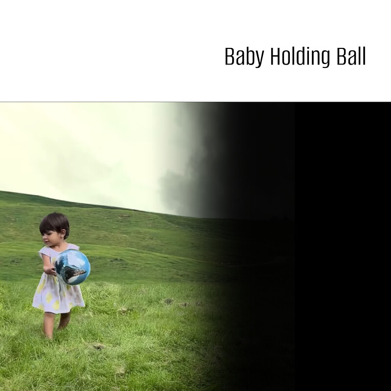 Baby holding ball