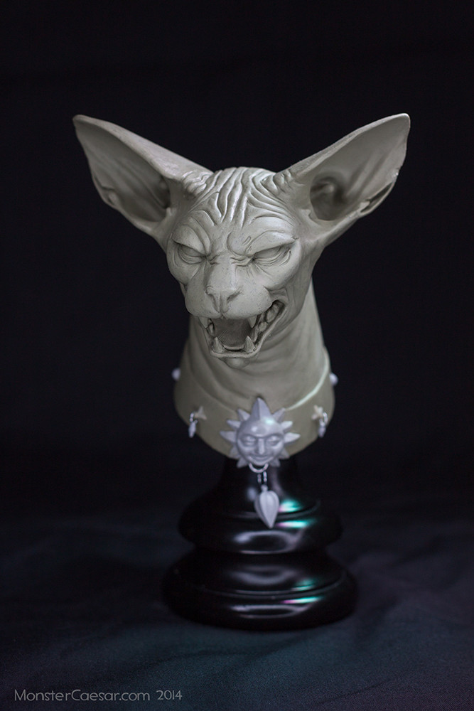 lying cat figure
