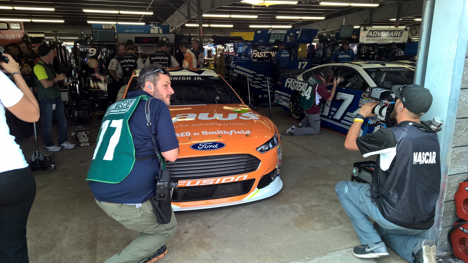 The #9 Shaw's Supermarkets Ford Fusion and NASCAR Sprint Cup Series driver Sam Hornish Jr. being filmed before a practice session from the garage at New Hampshire Motor Speedway. July 17th, 2015.