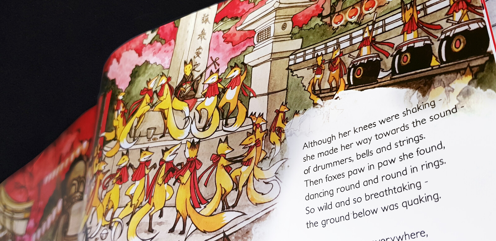 A page from Night of Foxes. The book is written in verse as a narrative poem. This scene is when the main character Mai has found the way to enter a feast for magical foxes in a hidden shrine.