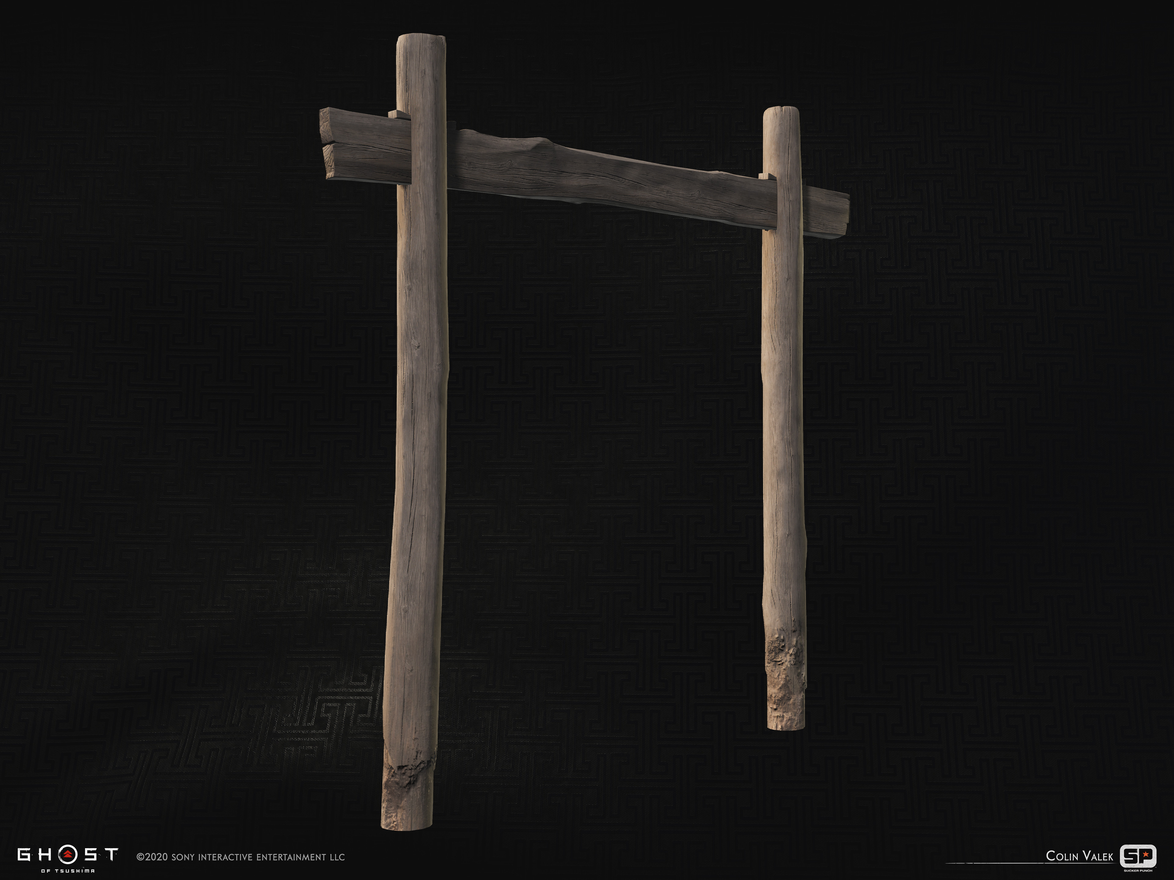 A wooden gate used to mark the entrance to a village.