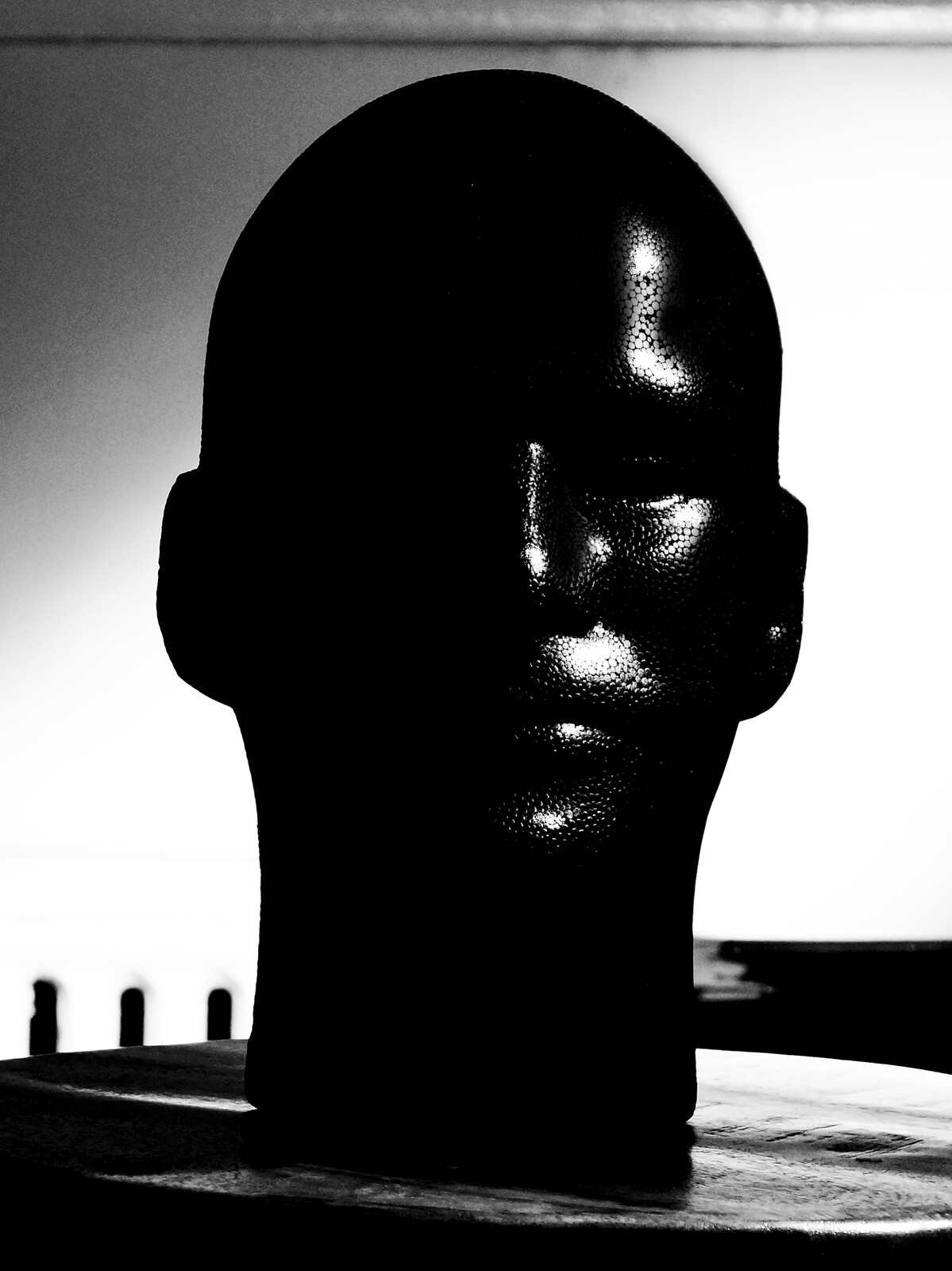 Photograph of a the manikin head demonstrating the  placement and properties of  of the highlight. Created by Vince Mancuso