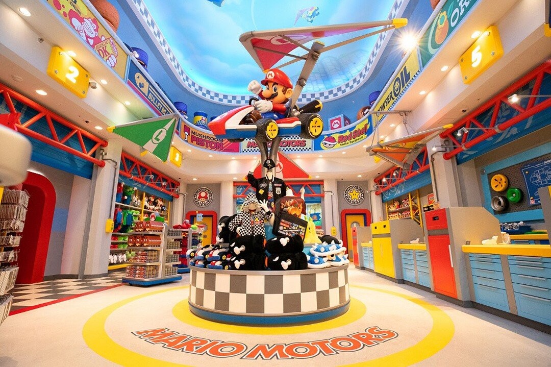 The medallions can also be found in the gift shop.

Photo from https://www.videogameschronicle.com/news/gallery-super-nintendo-world/ 

Here there are two medallions you can see towards the back of the store