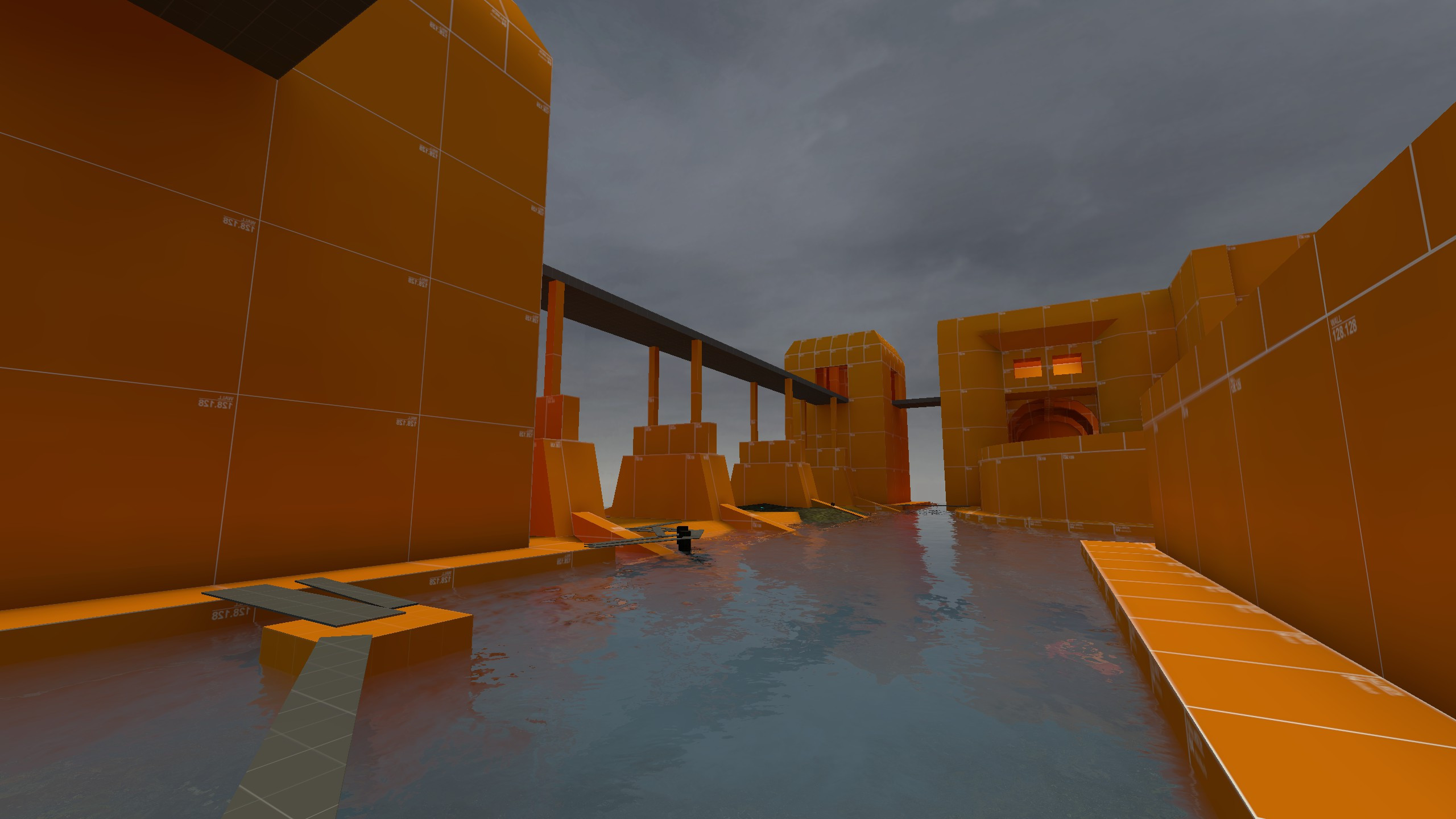 A blockout screenshot of the central exterior area of the map. This angle is from the lower water area.