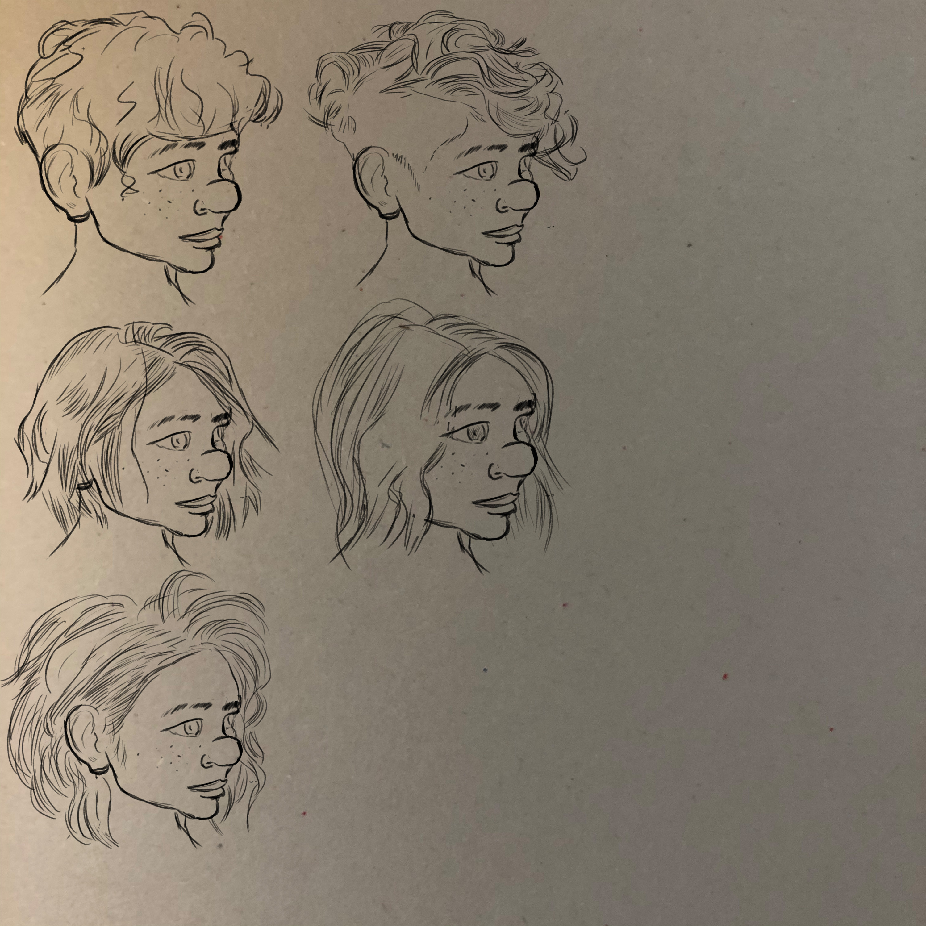Sketching ideas for a new haircut for her.