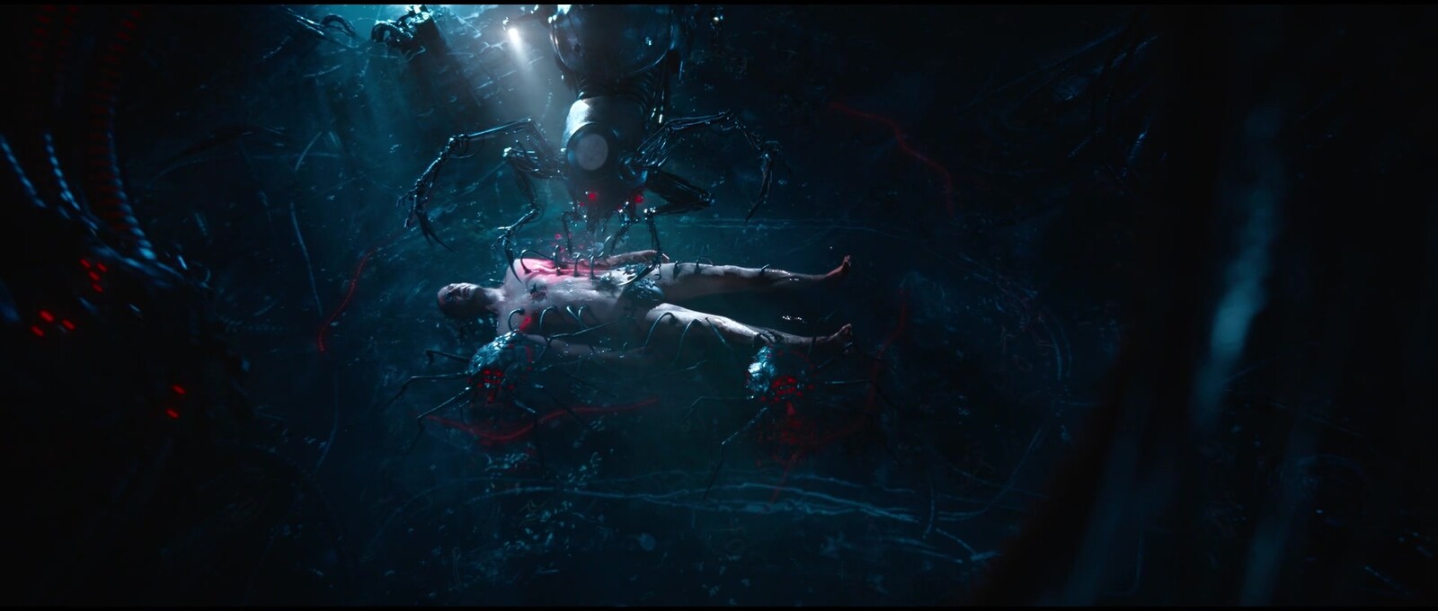 Frame from the movie scene. 
You can see two crab bots in the water below Neo's body,