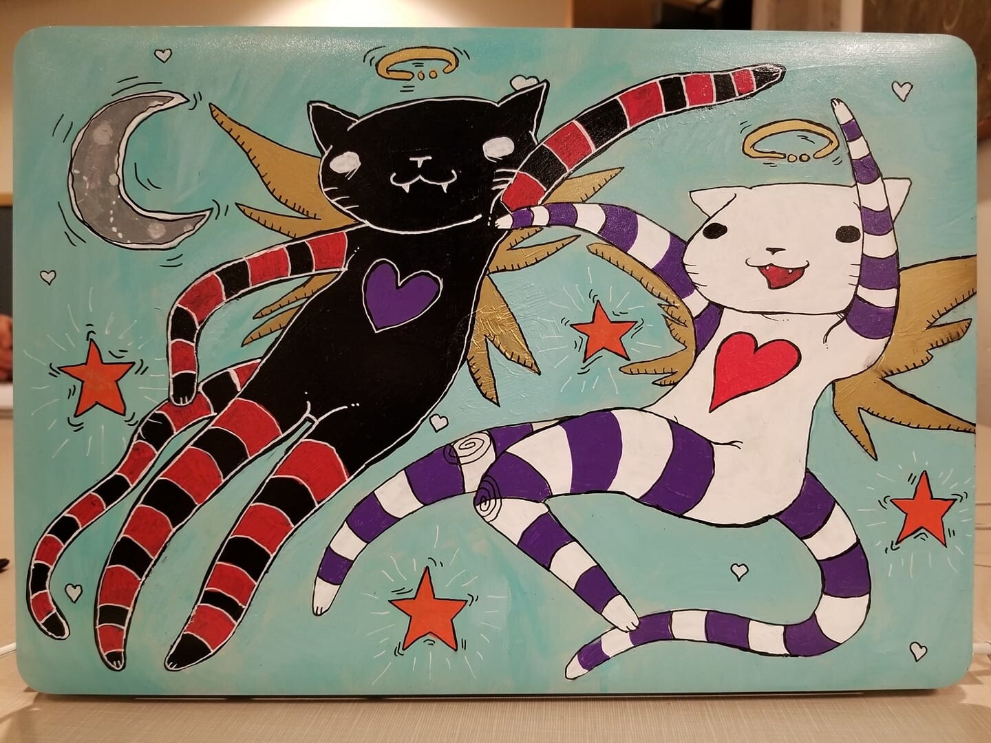 Cats - painted on the back of a laptop