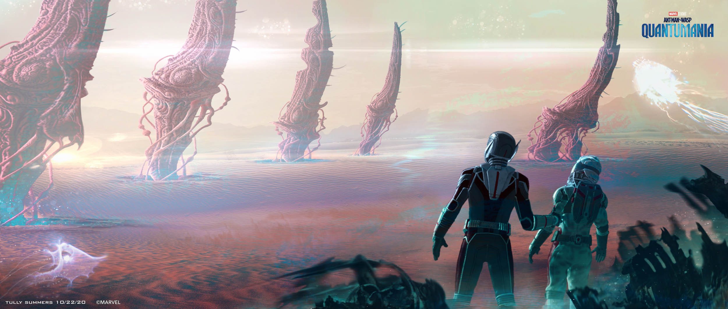 Ant-man and Cassie peer across a quantum desert, bristling with huge organic spires.