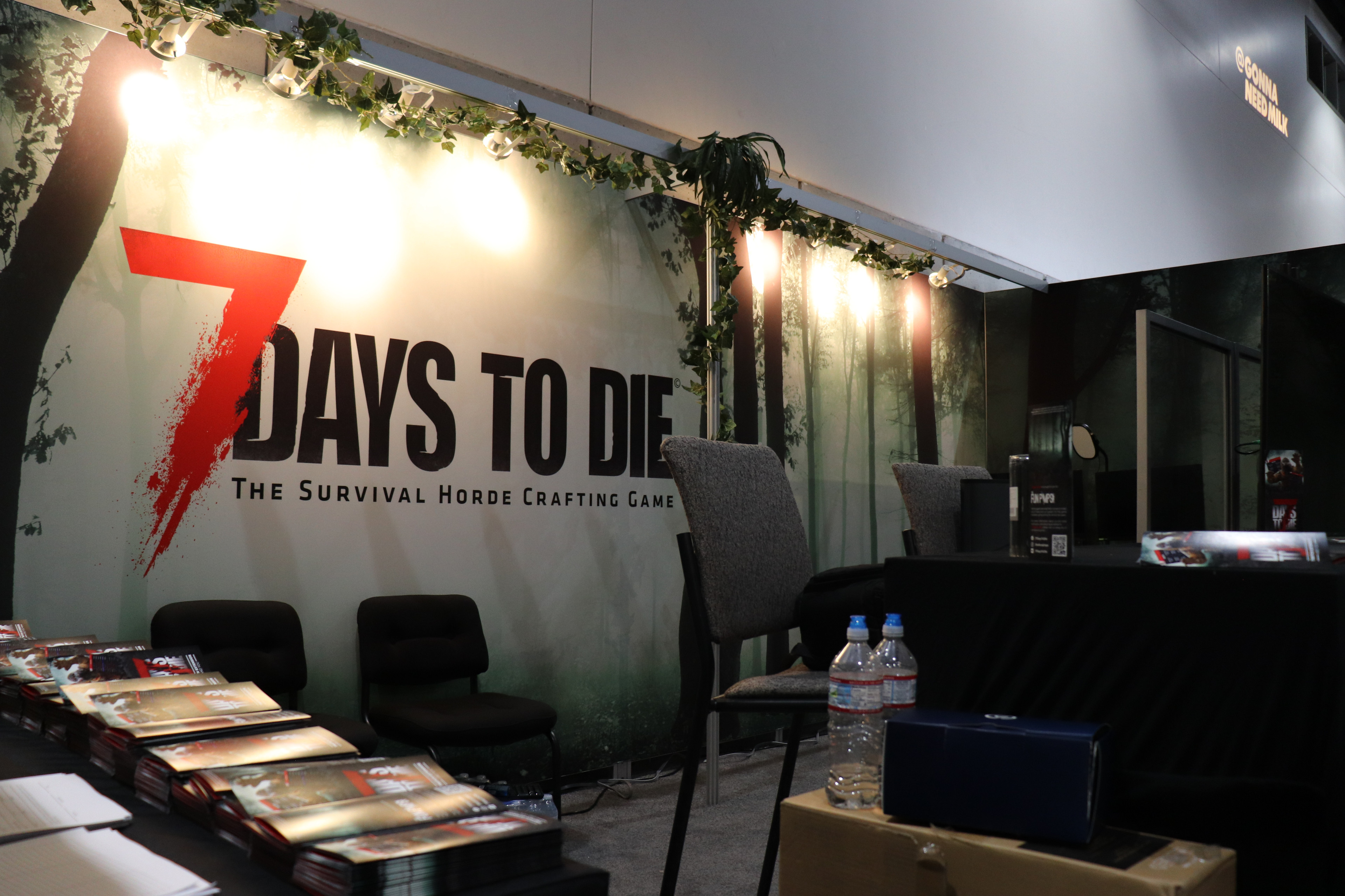 Photographs of the setup of the booth. We went without the "assembled rubble" look in the initial concept and leaned into foliage instead. I personally decorated the booth, and helped run it during the event.
