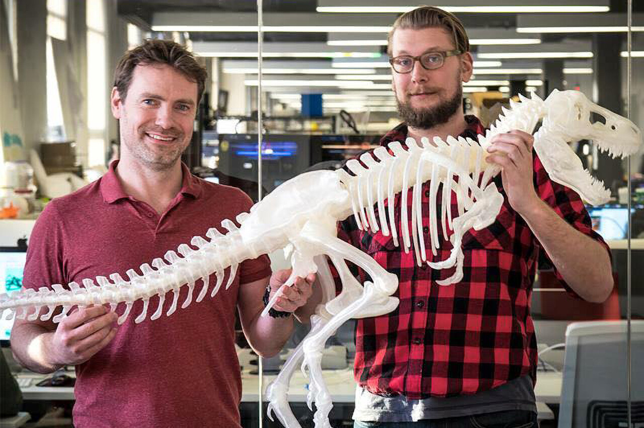 Makerbot Engineers holding a huge 3D Print of the T-Rex!