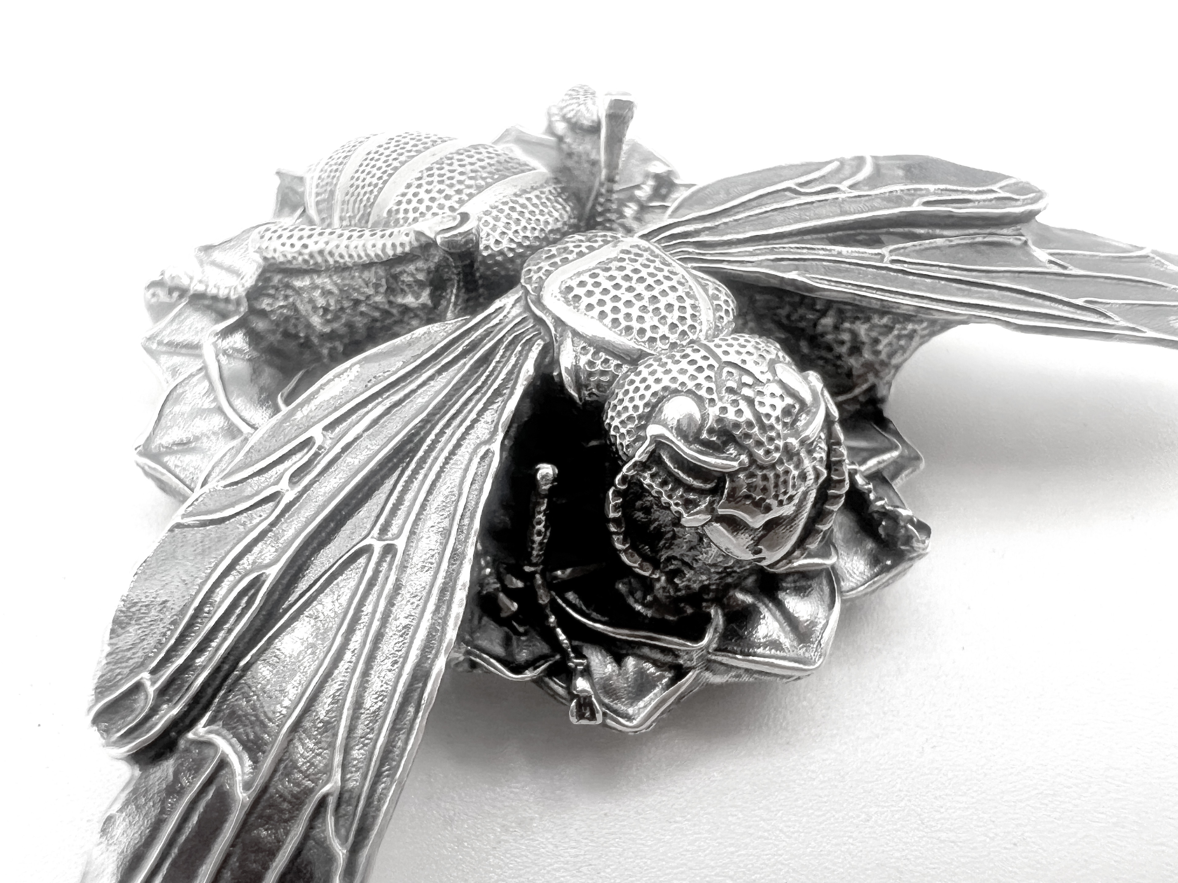 Photo of the Vespa Mandarinia brooch cast in sterling silver