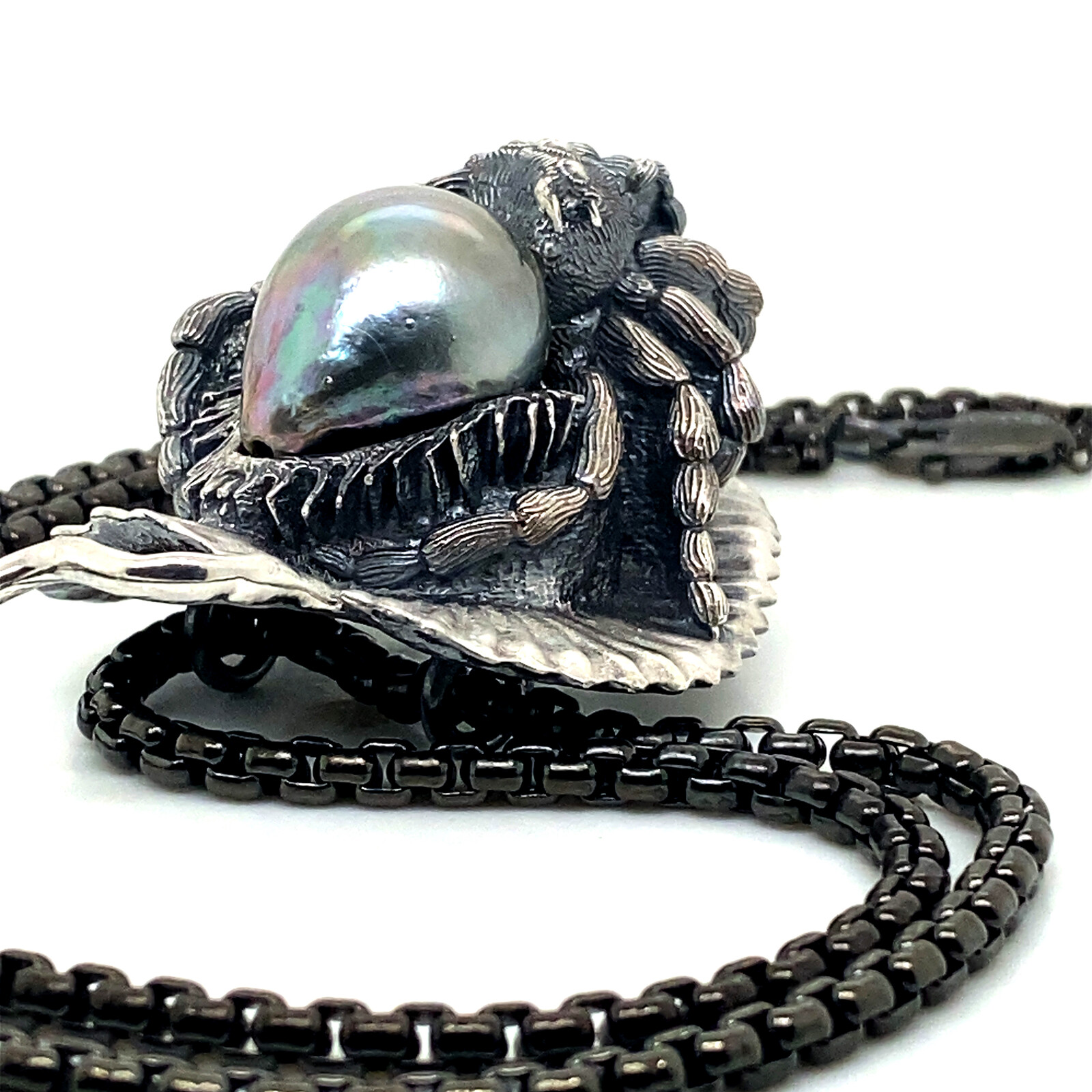 Photo of the pendant cast in sterling silver with a Tahitian pearl for the abdomen.