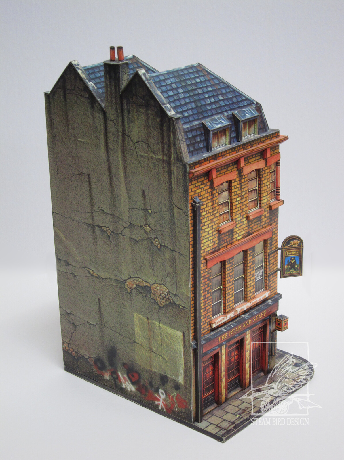 Cut and Assembly Model of "The Bear and Staff" pub in the London theater district. Published by Dover Publications 1992. 
Assembled view 2.