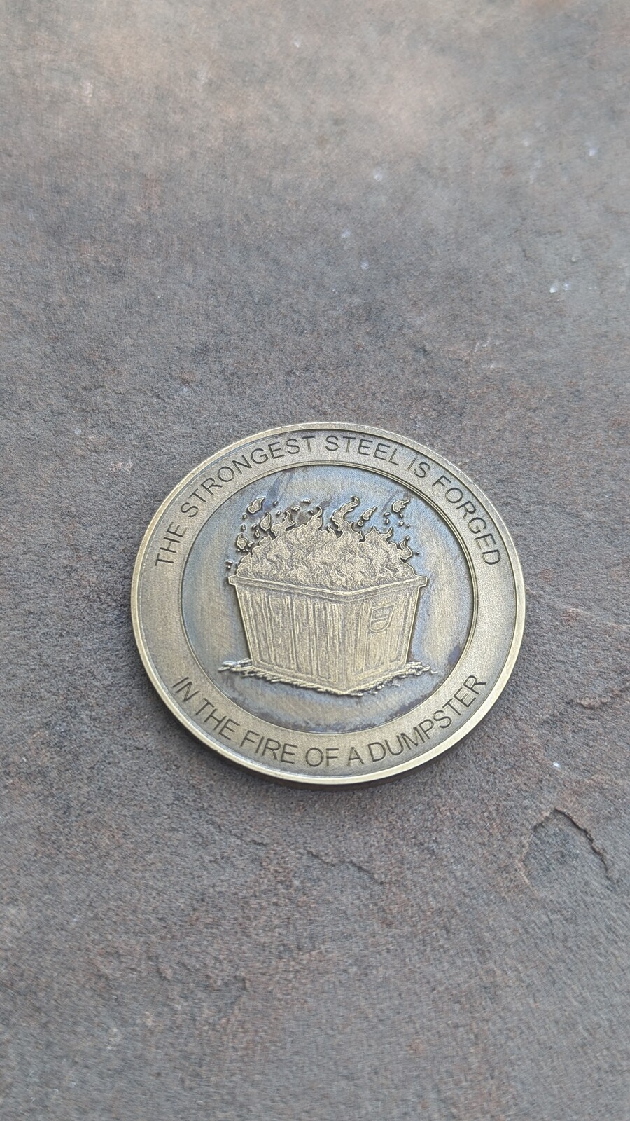 Joke Coin "The strongest steel is forged in the fire of a dumpster"  (Brass)