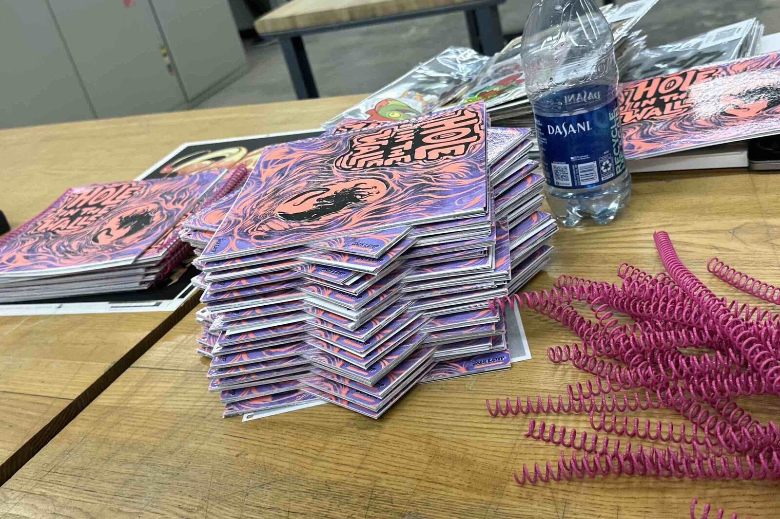 Each booklet laid out after being printed, cut and organized.
