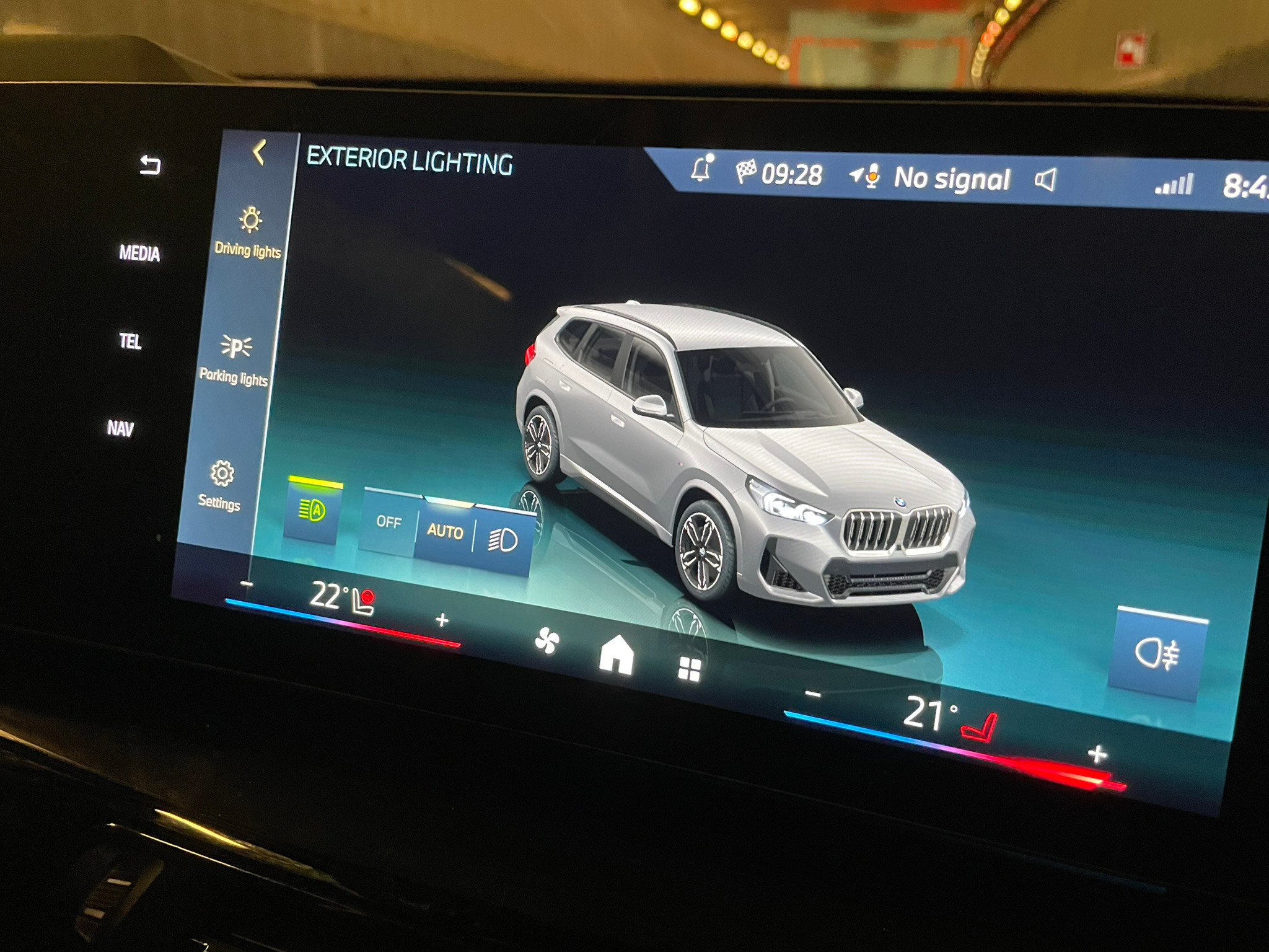 The car in action on the screen of an actual X1