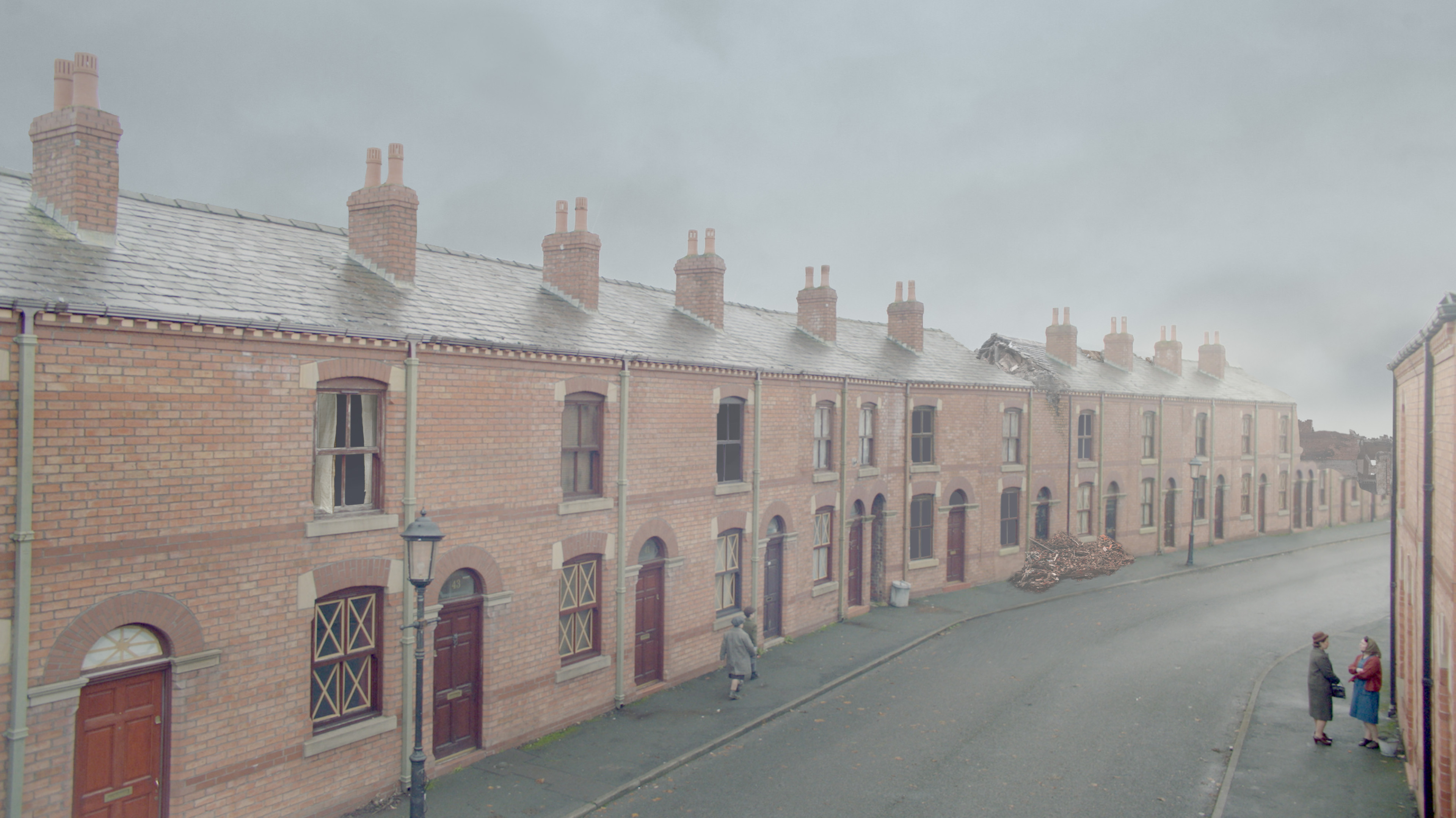 I added all the damage to the buildings in this shot filmed on a normal street in Manchester.