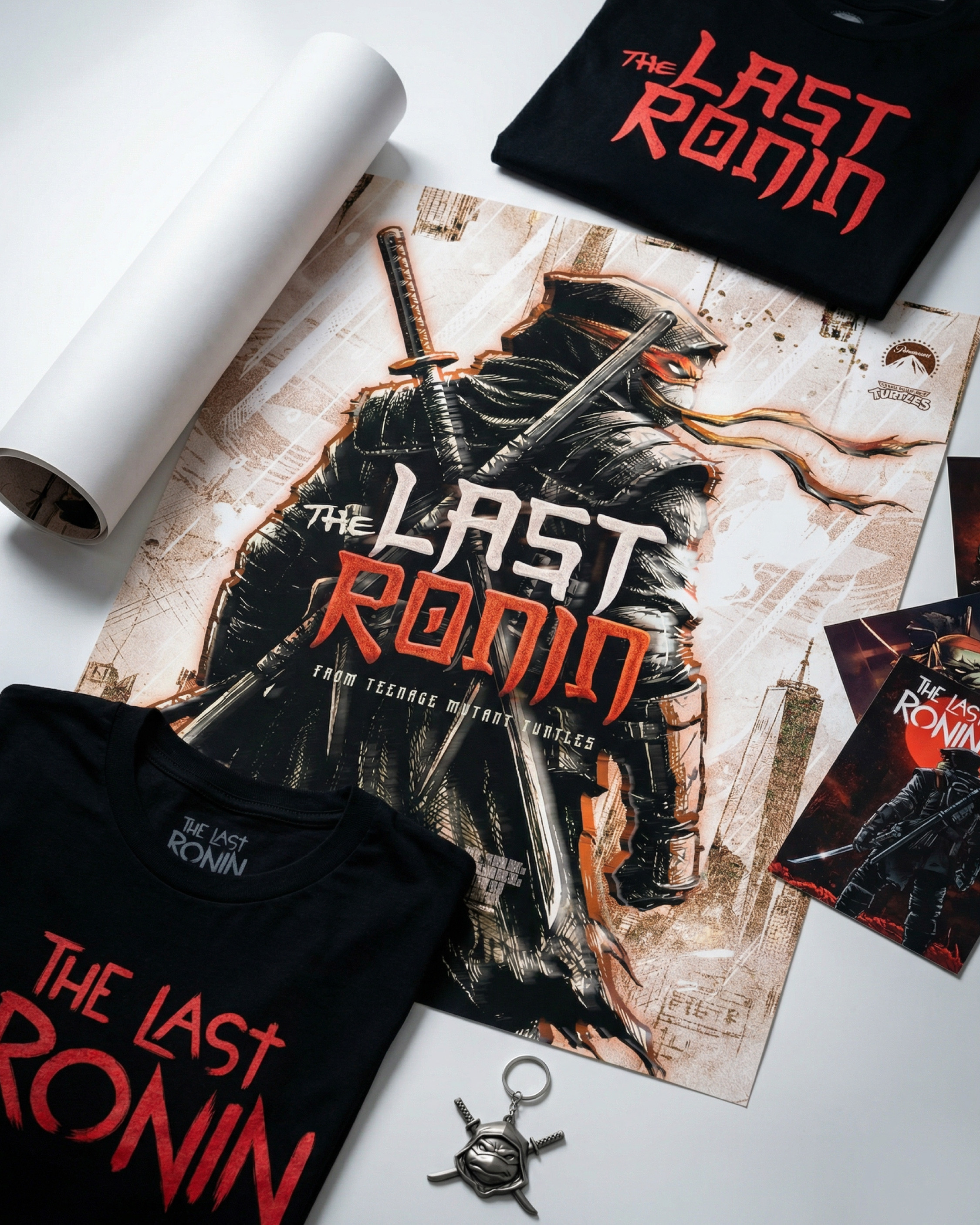 Exploration of how the key art extends into physical merchandise including apparel, rolled prints, and branded accessories. Designed to retain impact and legibility across tactile formats
