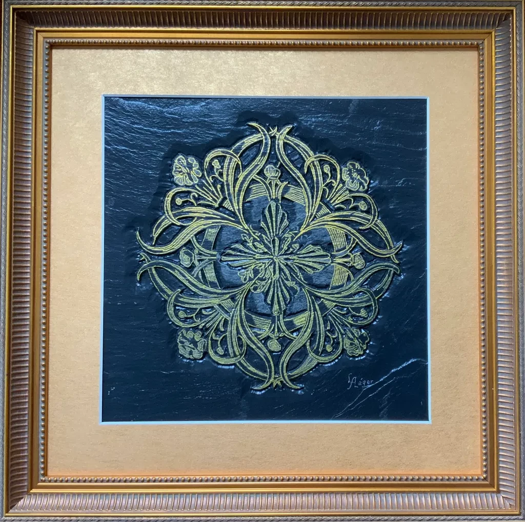 Golden Round Scroll is a hand-carved bas-relief on black slate, finished with luminous gold linework. Inspired by classical scrollwork, this piece brings together tactile depth and elegant curves.