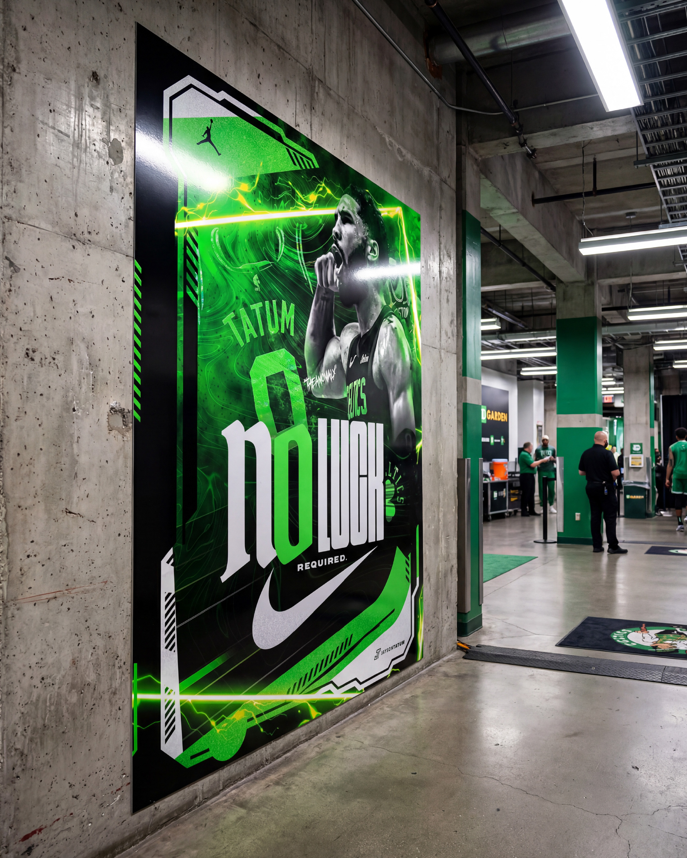 Inside TD Garden. The poster mounted on the concrete corridor wall with the arena signage visible in the background. This is where it belongs. Boston. The Garden. Home