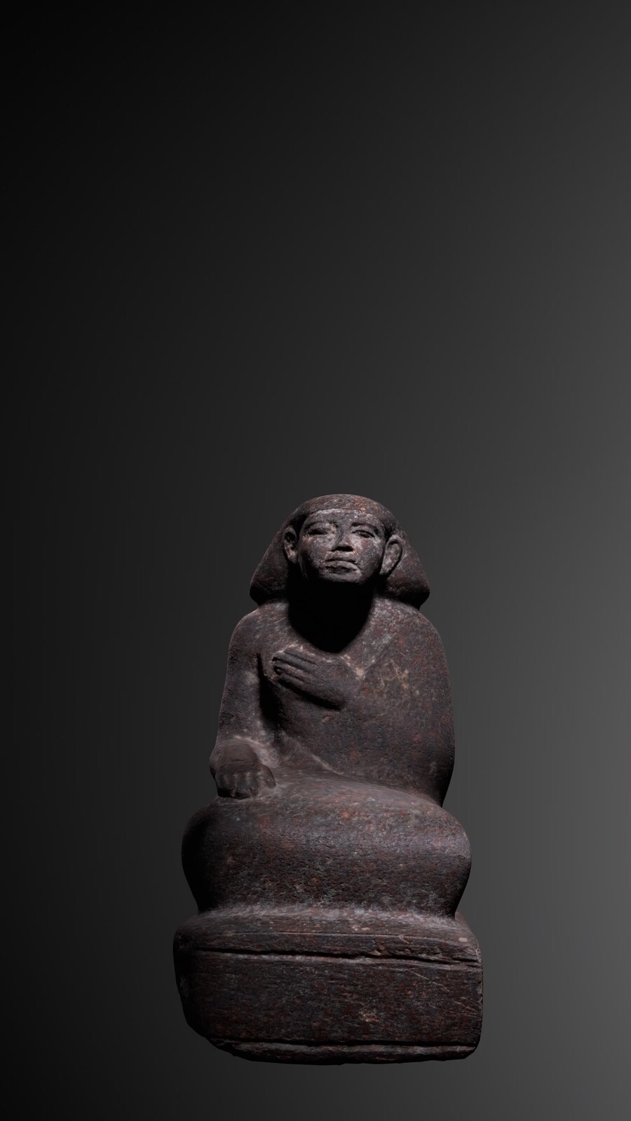STATUE OF A SEATED MAN