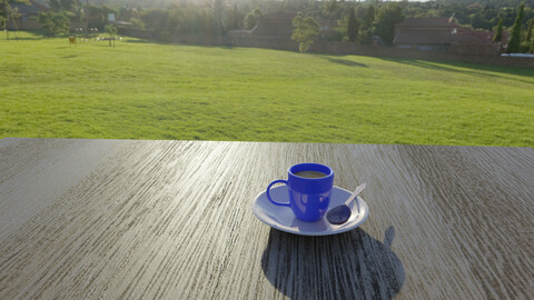 Cup and saucer with a spoon