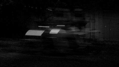Black and white speed of a car, a motorcycle and a running man.