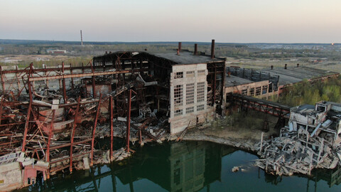 240+ Aerial photos of a man-made sinkhole during mining operations, an abandoned failed village, a mine building