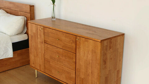 Brownie gold console type wooden chest of drawers